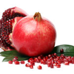 Delicious, exotic pomegranate fruit on white background